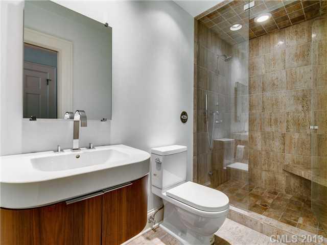 2726 Sharon Road Charlotte, NC 28211 - Photo 10 of 16 a bathroom with a sink toilet and shower