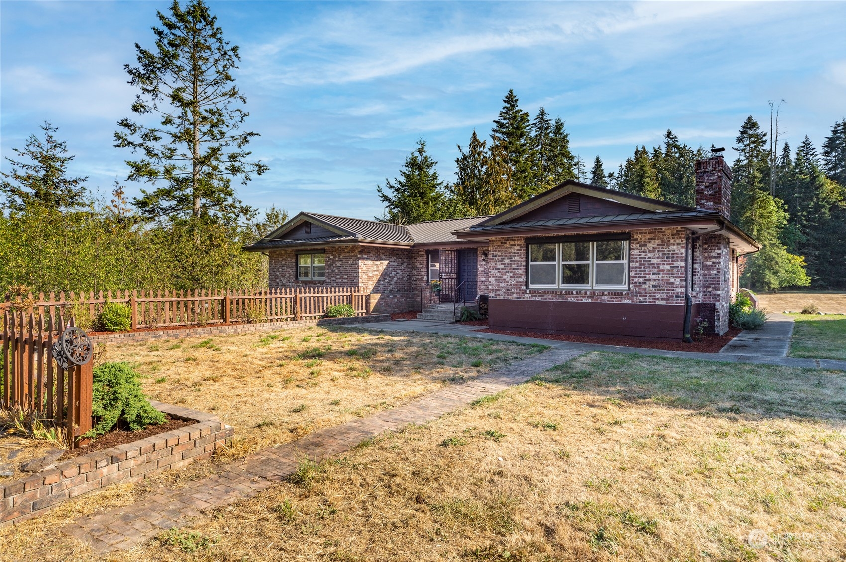 143 Senz Road Sequim, WA 98382 - Photo 1 of 40 a view of a house with a yard