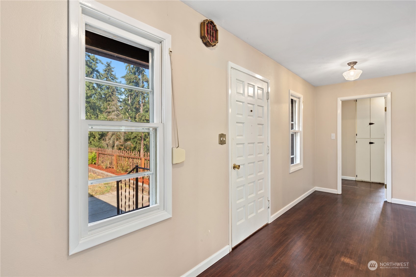 143 Senz Road Sequim, WA 98382 - Photo 5 of 40 a view of an empty room with wooden floor and a window