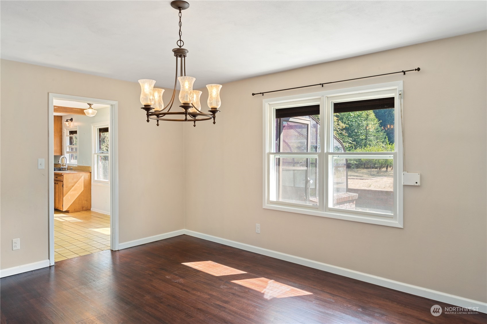143 Senz Road Sequim, WA 98382 - Photo 8 of 40 a view of empty room with wooden floor and window