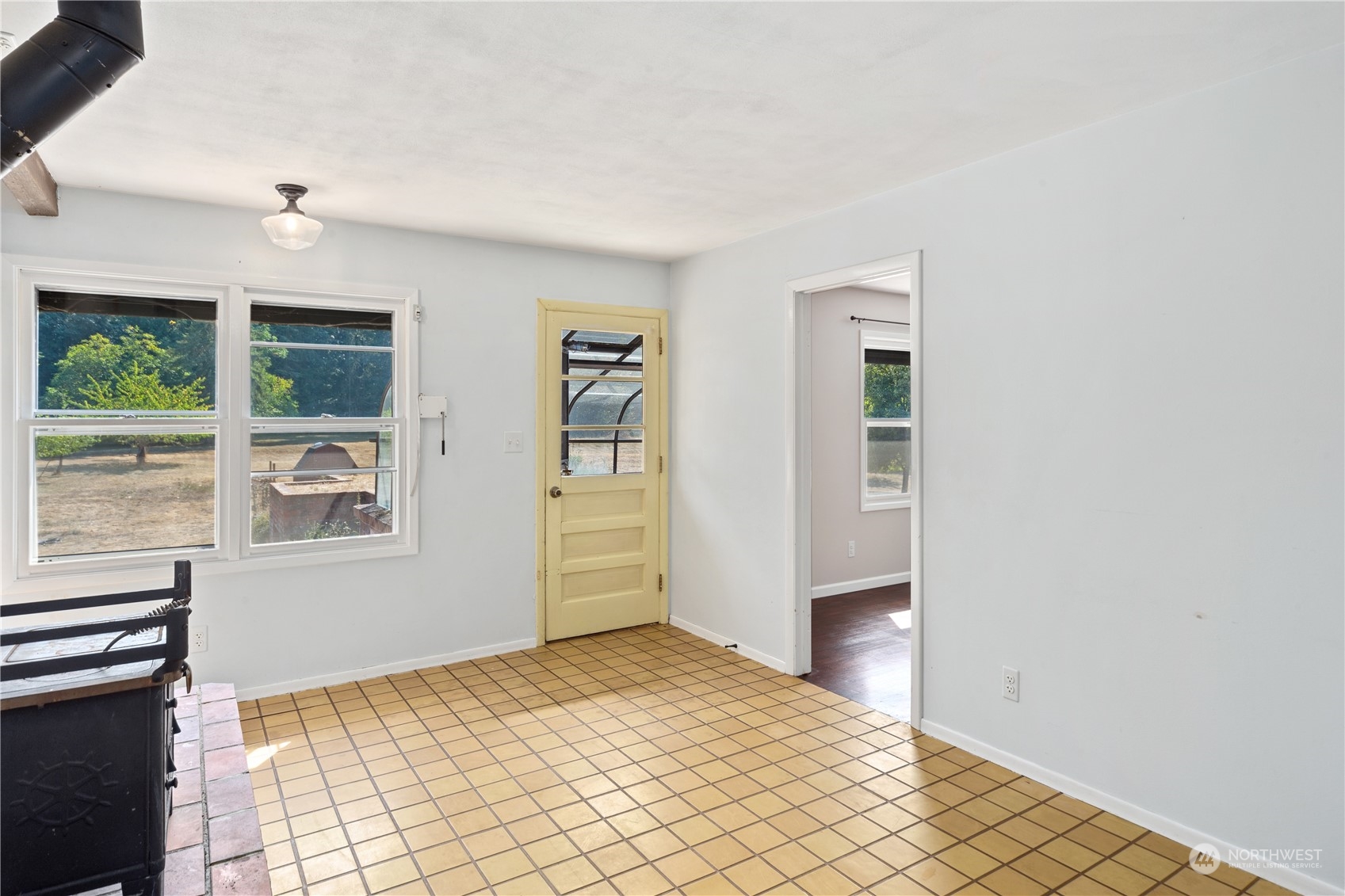 143 Senz Road Sequim, WA 98382 - Photo 10 of 40 a view of a bedroom with wooden floor and windows