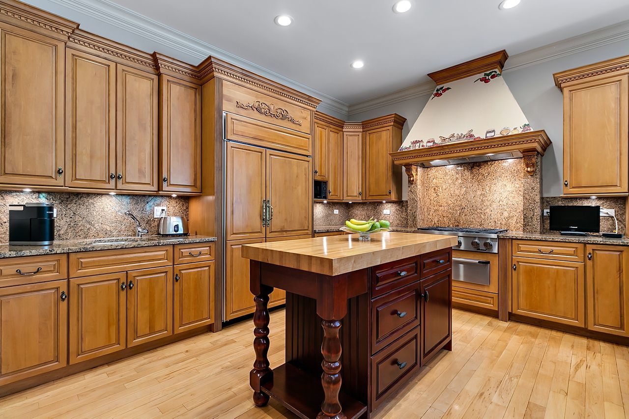 1130 Glenview Road Glenview, IL 60025 - Photo 15 of 66 a kitchen with stainless steel appliances granite countertop a stove a sink dishwasher and a refrigerator
