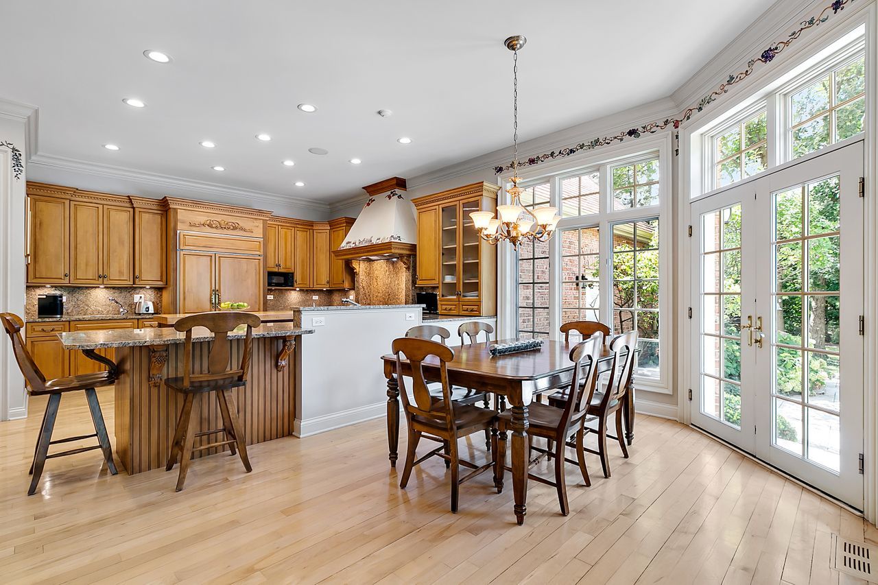 1130 Glenview Road Glenview, IL 60025 - Photo 20 of 66 a view of a dining room with furniture window and wooden floor