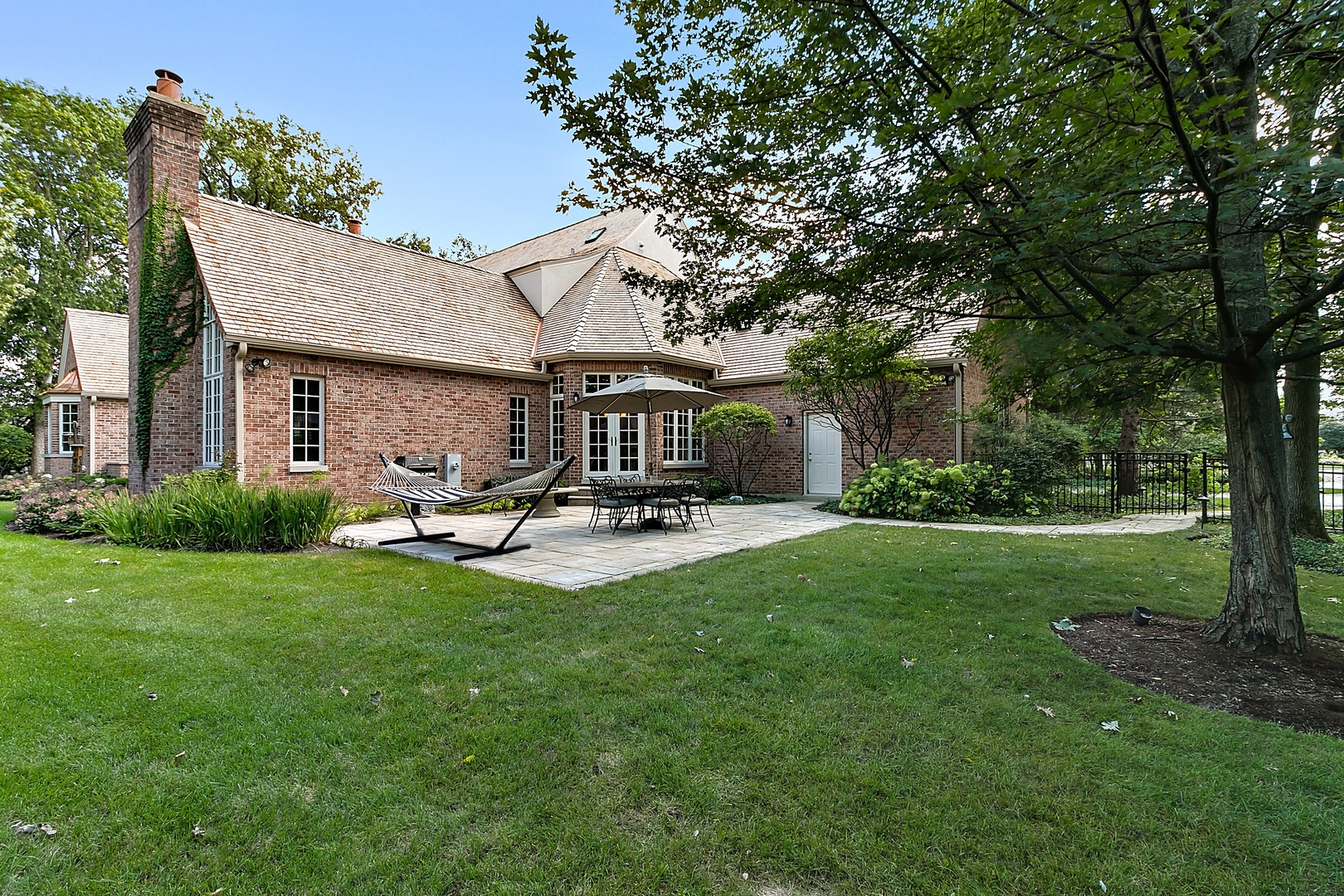 1130 Glenview Road Glenview, IL 60025 - Photo 22 of 66 a view of patio with table and chairs under an umbrella