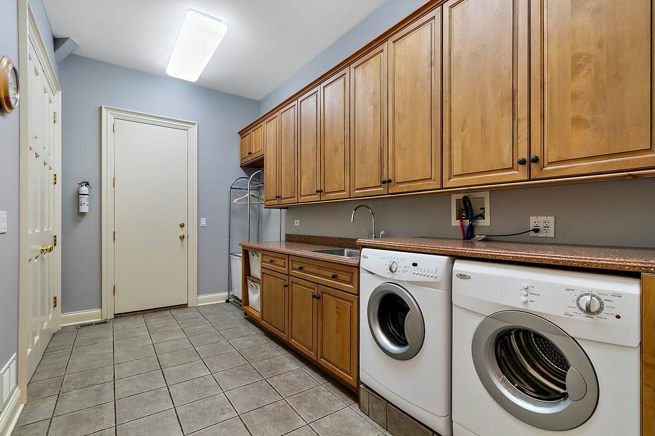 1130 Glenview Road Glenview, IL 60025 - Photo 23 of 66 a view of a kitchen with washer and dryer