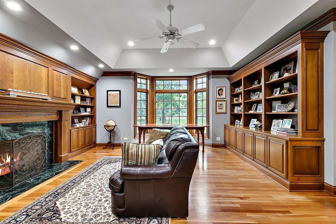 1130 Glenview Road Glenview, IL 60025 - Photo 27 of 66 a living room with furniture fireplace and bookshelf