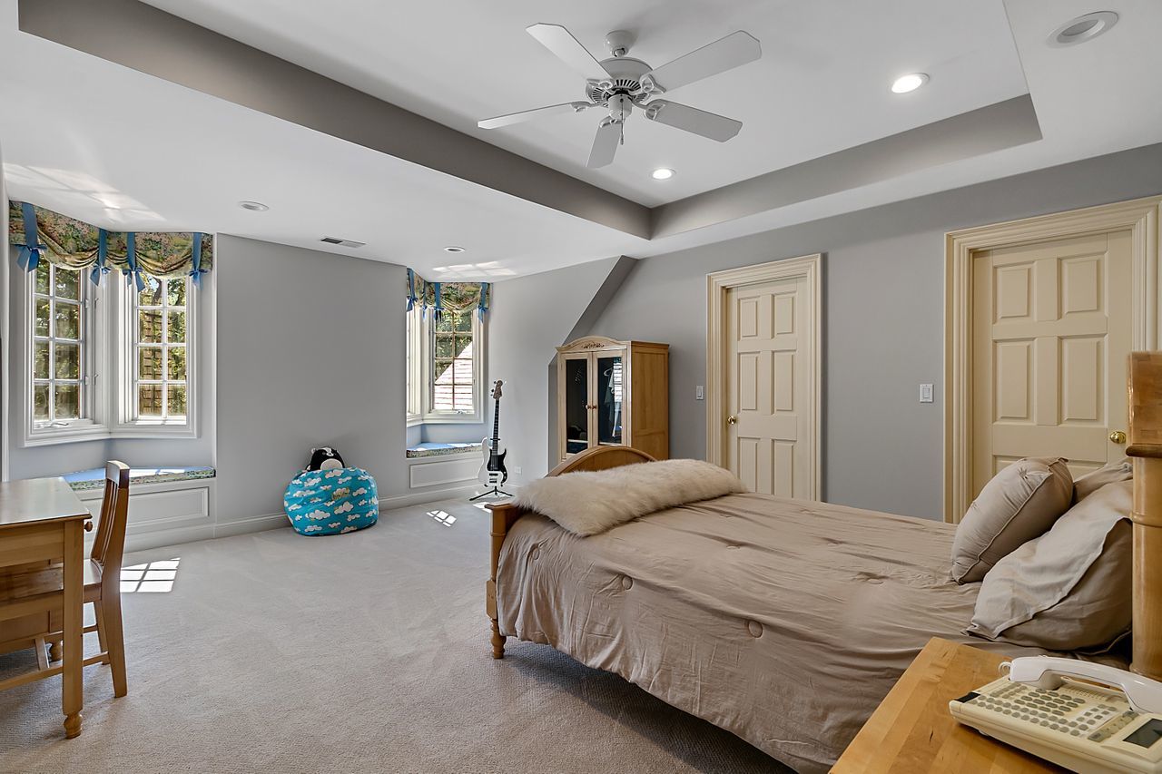 1130 Glenview Road Glenview, IL 60025 - Photo 38 of 66 a spacious bedroom with a bed and furniture