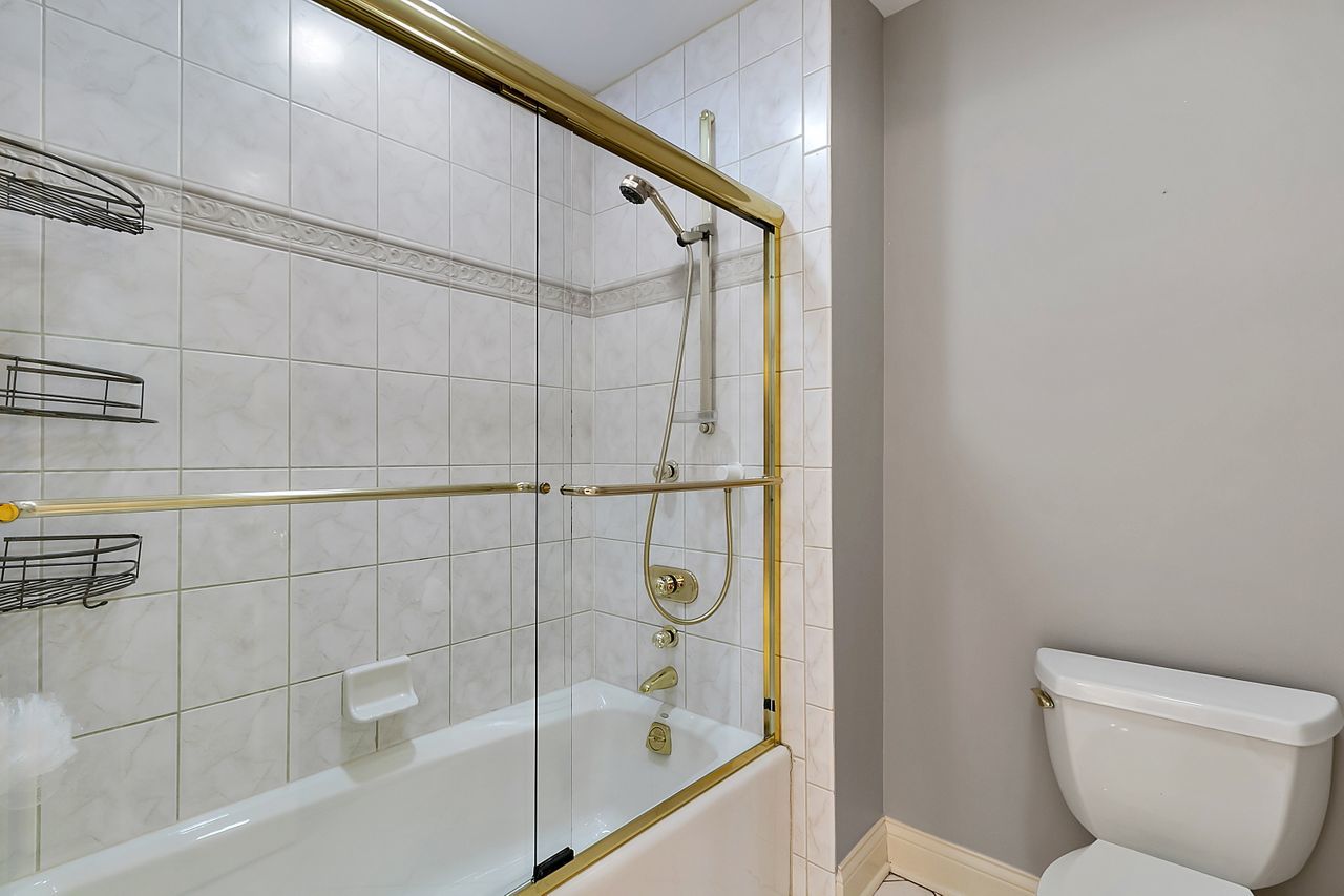 1130 Glenview Road Glenview, IL 60025 - Photo 40 of 66 a bathroom with a bathtub and a shower
