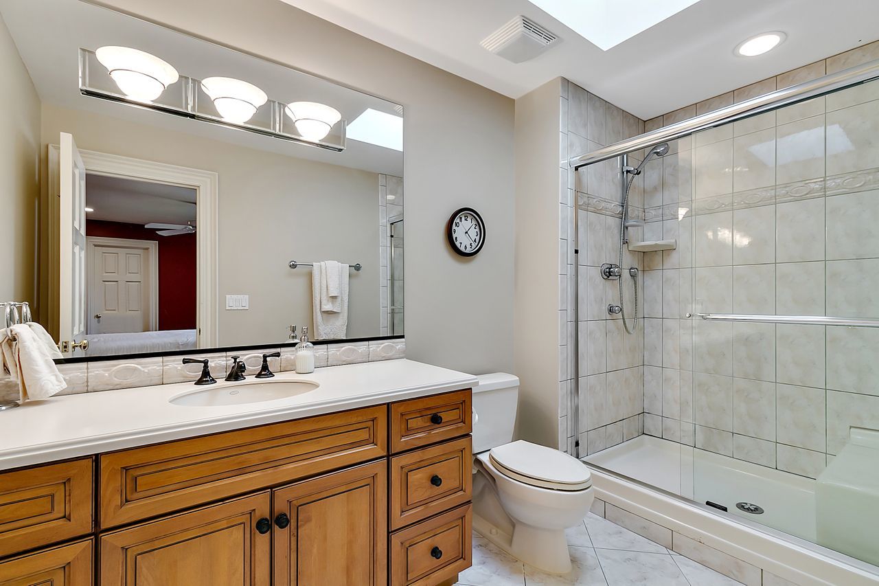 1130 Glenview Road Glenview, IL 60025 - Photo 43 of 66 a bathroom with a sink a toilet and shower