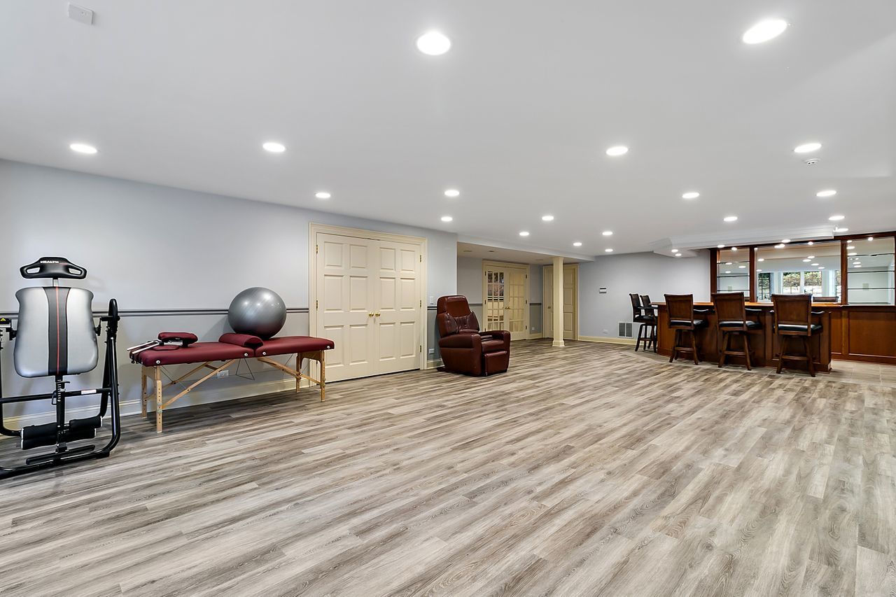 1130 Glenview Road Glenview, IL 60025 - Photo 49 of 66 a living room with furniture a table tennis and a wooden floor