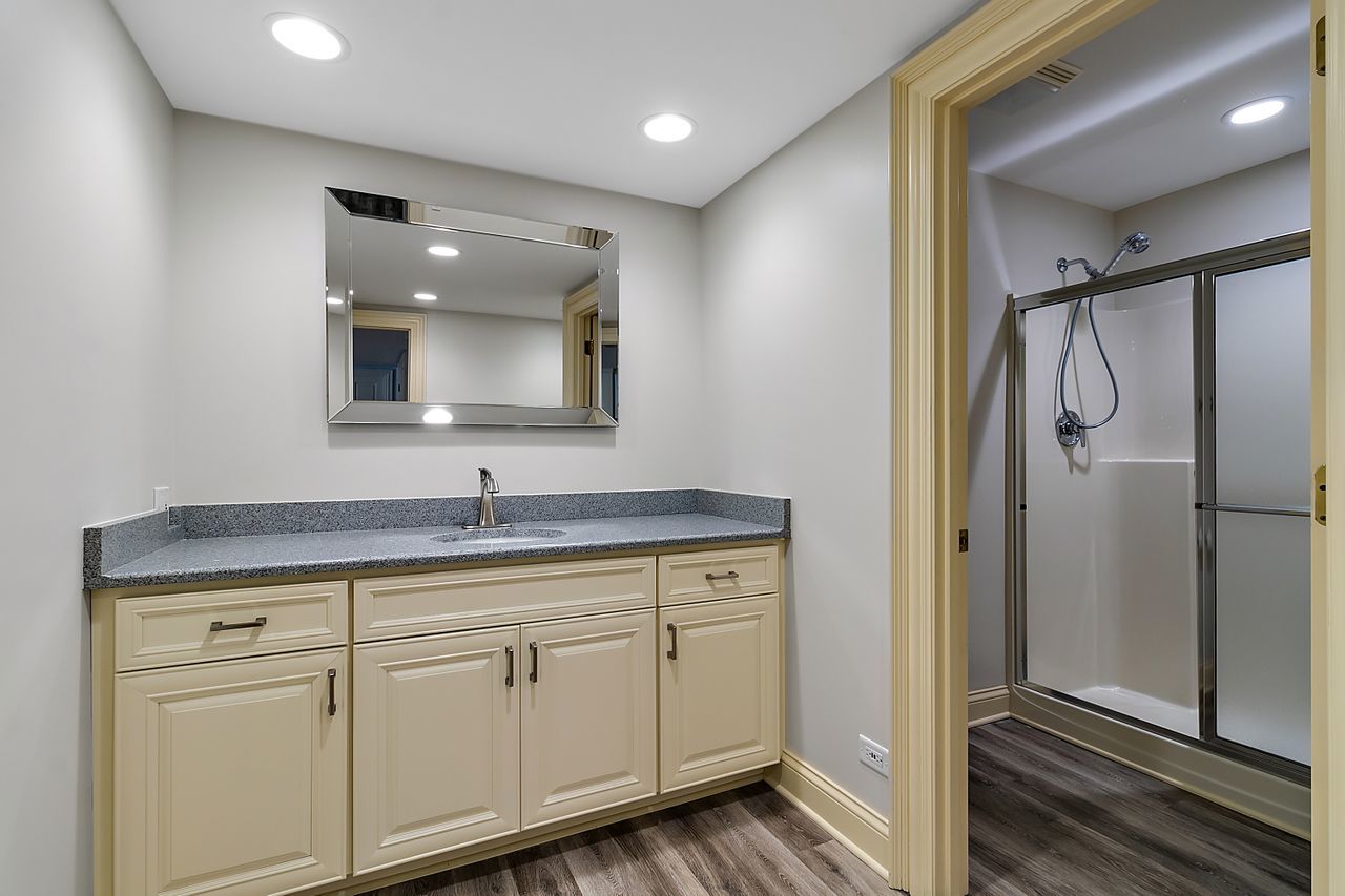 1130 Glenview Road Glenview, IL 60025 - Photo 53 of 66 a bathroom with a granite countertop sink double and mirror