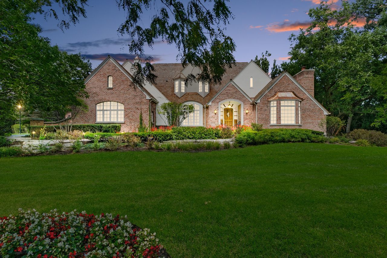 1130 Glenview Road Glenview, IL 60025 - Photo 66 of 66 a front view of a house with a garden