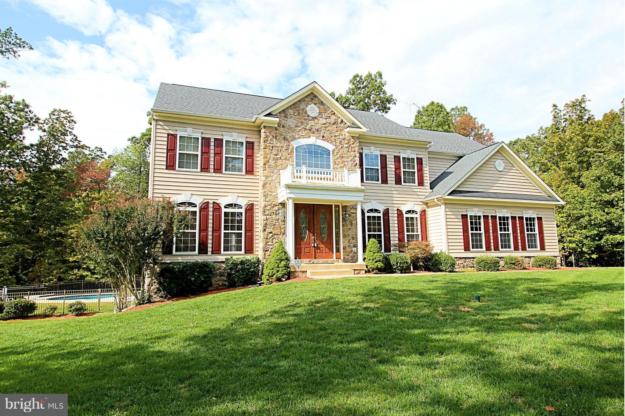 68 Willow Ridge Court Fredericksburg, VA 22406 - Photo 1 of 30 a front view of a house with a yard