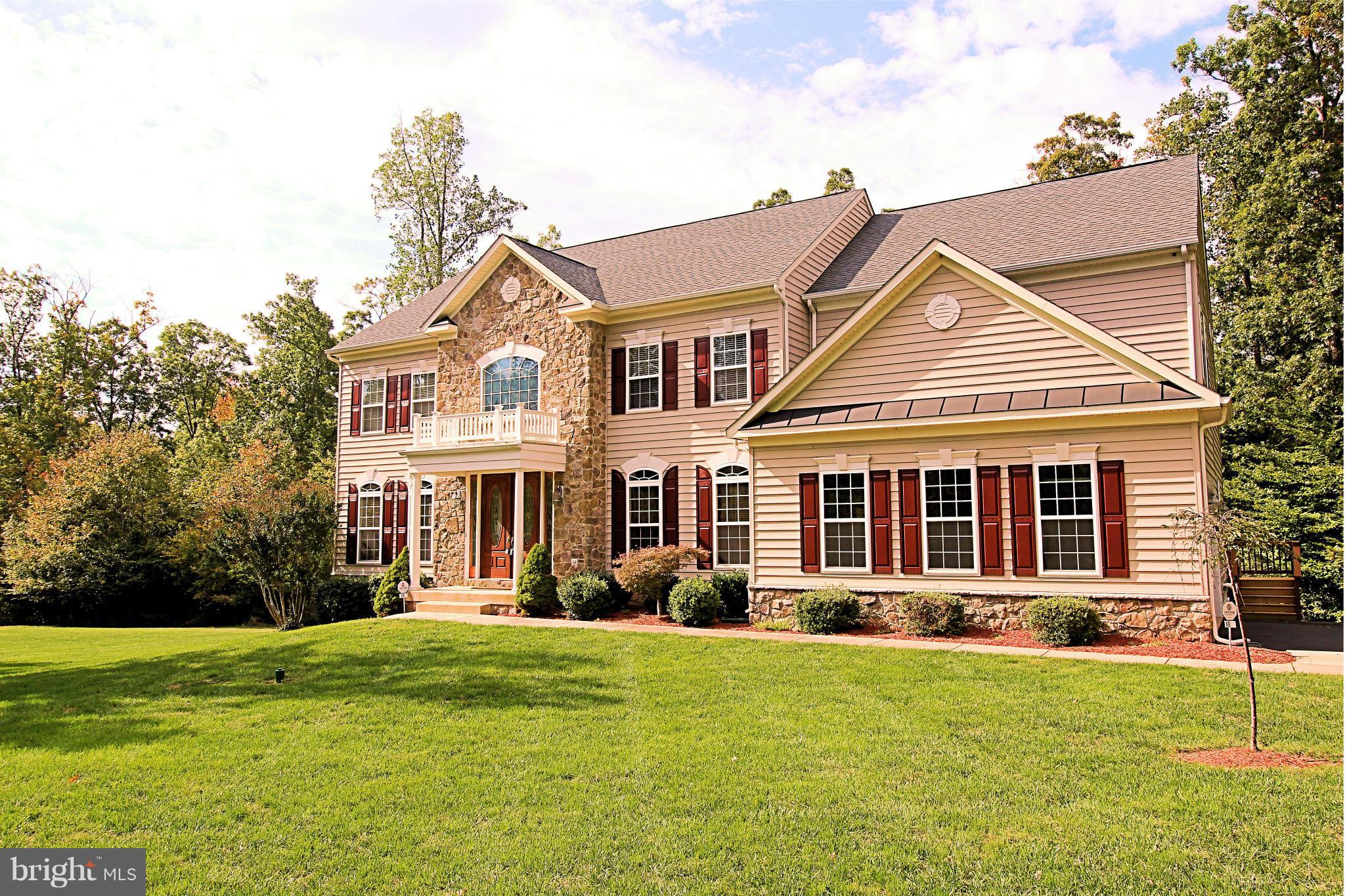 68 Willow Ridge Court Fredericksburg, VA 22406 - Photo 2 of 30 front view of a house with a yard
