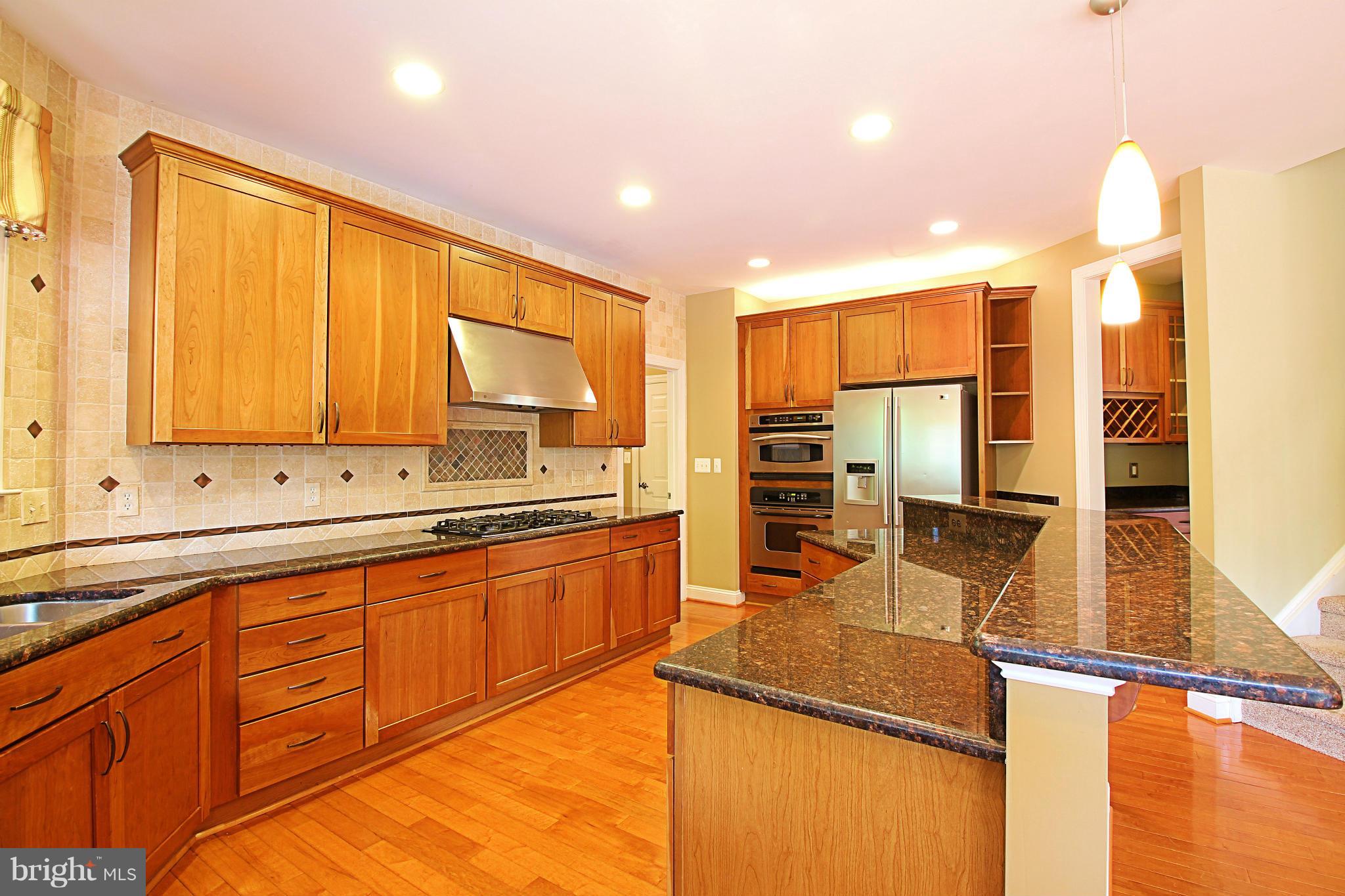 68 Willow Ridge Court Fredericksburg, VA 22406 - Photo 11 of 30 a kitchen with stainless steel appliances granite countertop a sink stove and cabinets