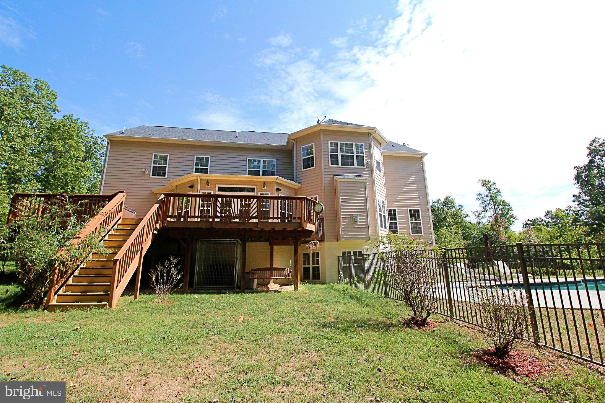 68 Willow Ridge Court Fredericksburg, VA 22406 - Photo 3 of 30 a front view of a house with a yard