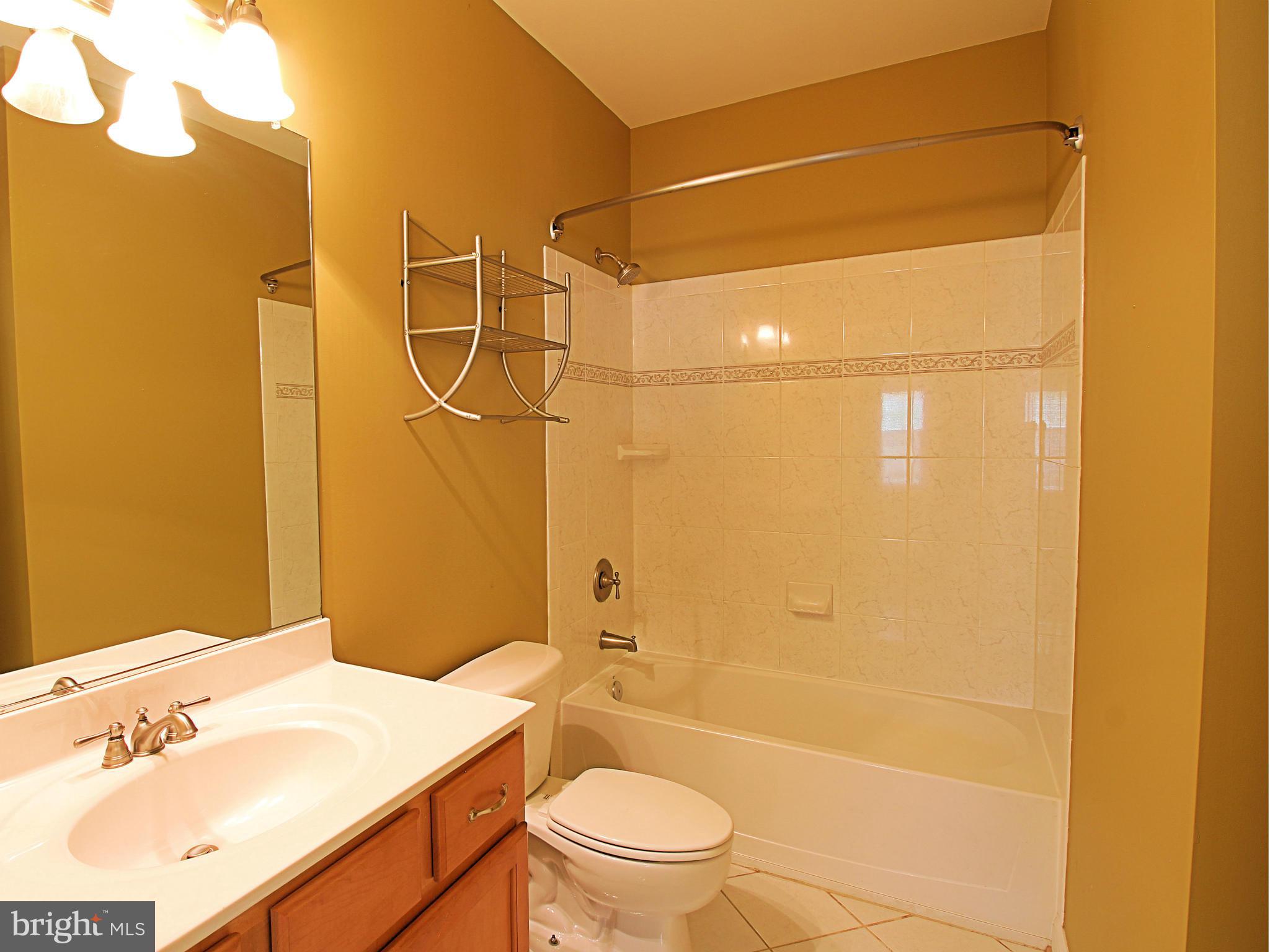 68 Willow Ridge Court Fredericksburg, VA 22406 - Photo 28 of 30 a bathroom with a granite countertop sink toilet and shower