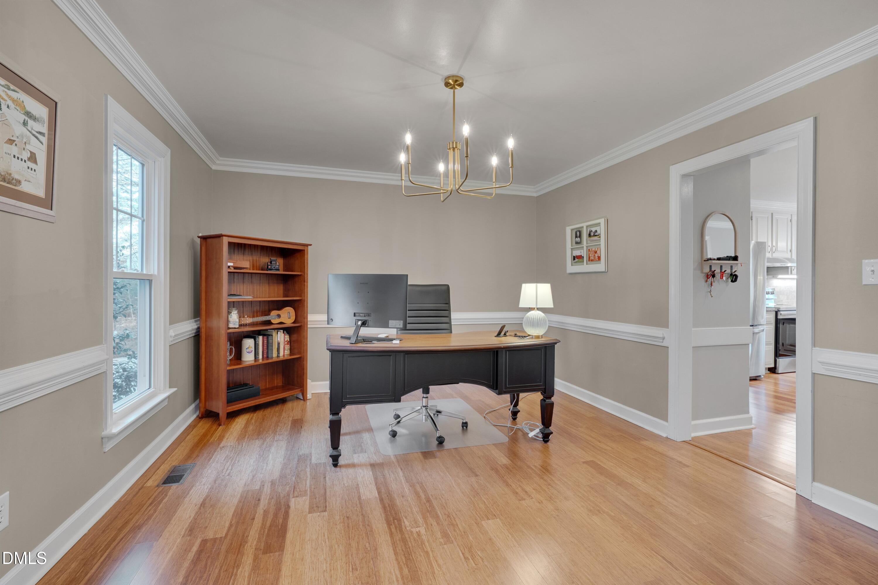 7900 Kingsland Drive Raleigh, NC 27613 - Photo 14 of 32 a workspace with wooden floor