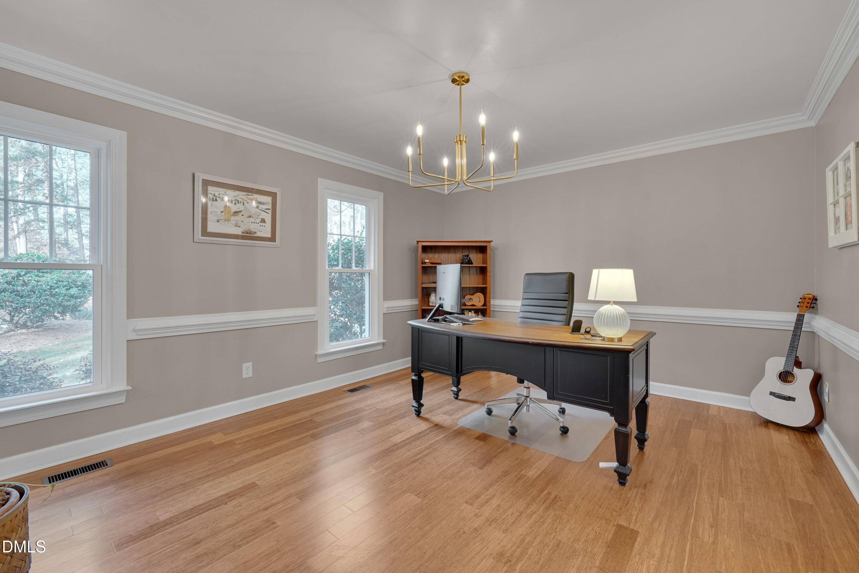 7900 Kingsland Drive Raleigh, NC 27613 - Photo 15 of 32 a workspace with wooden floor