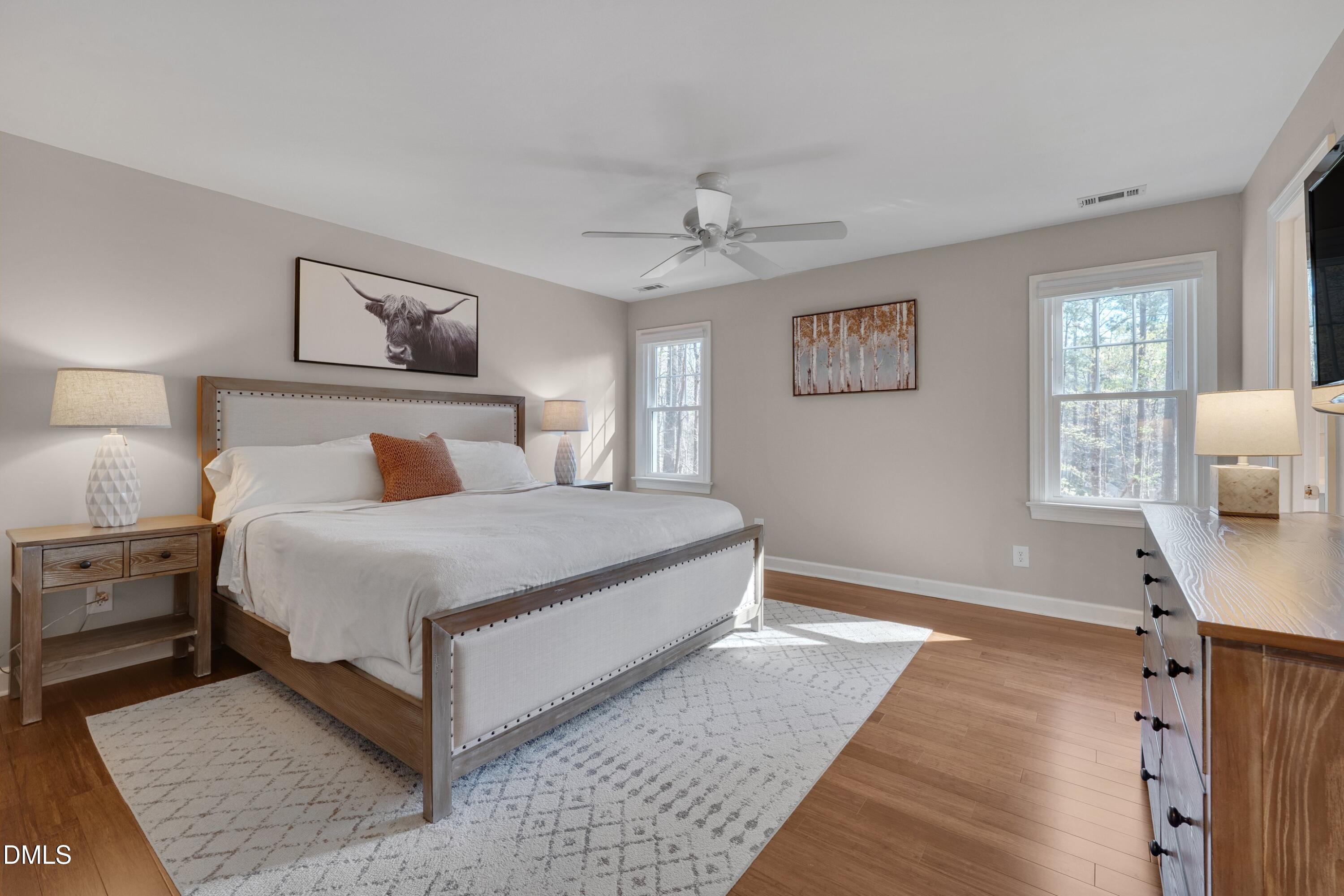 7900 Kingsland Drive Raleigh, NC 27613 - Photo 16 of 32 a bedroom with a large bed and a window
