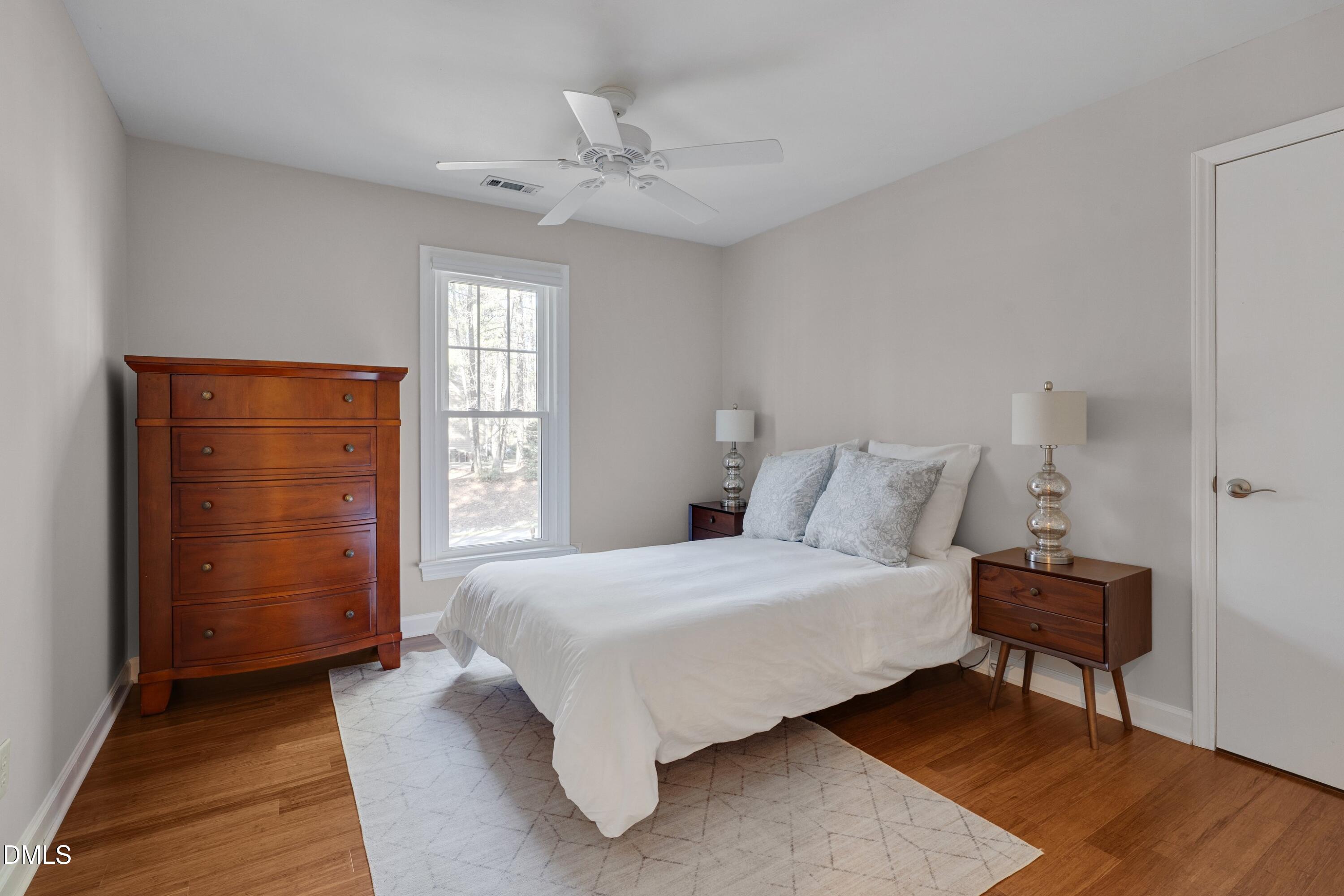 7900 Kingsland Drive Raleigh, NC 27613 - Photo 19 of 32 a bedroom with a bed and a window