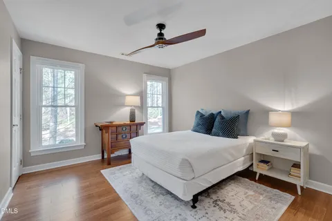 a bedroom with a large bed and a window