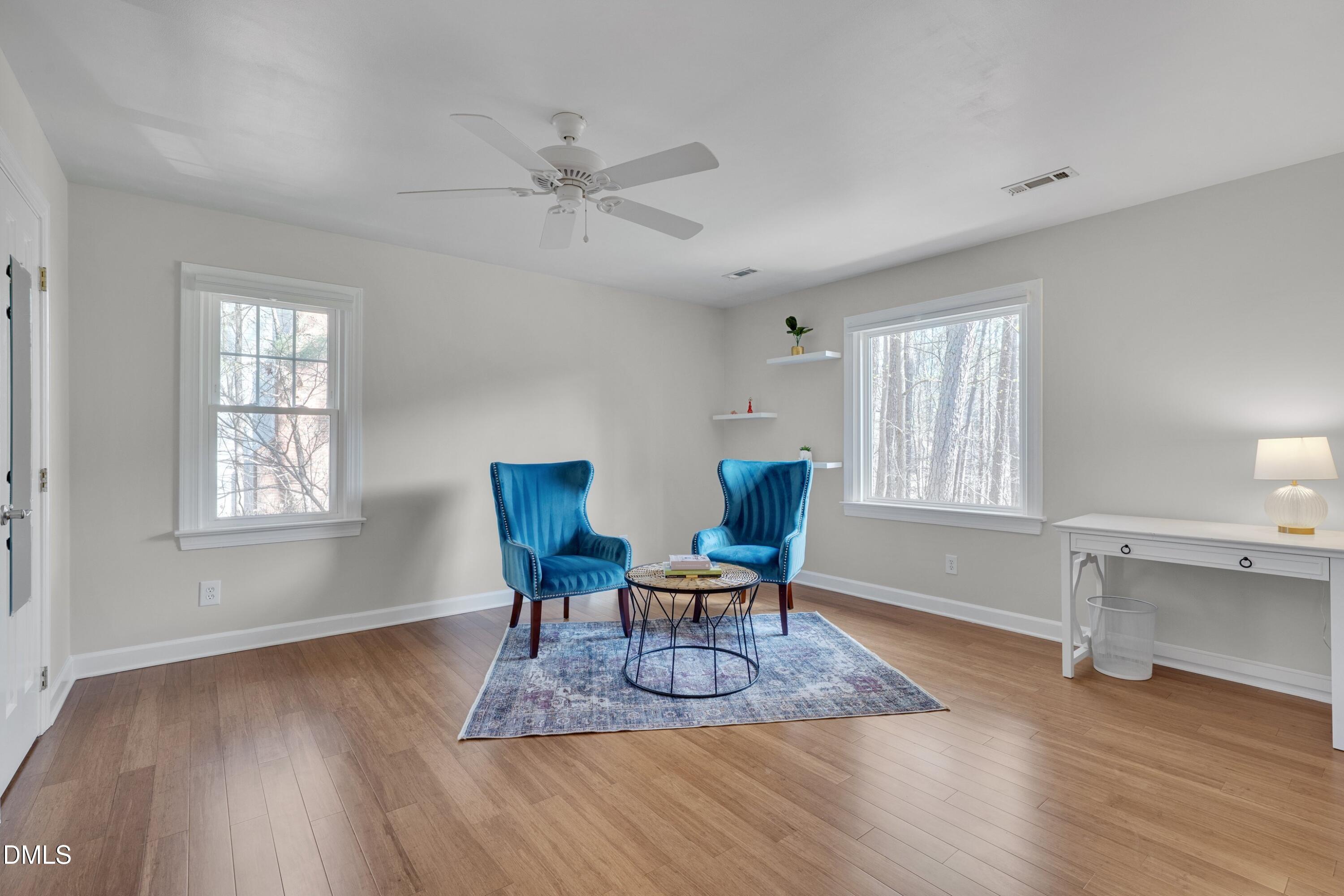 7900 Kingsland Drive Raleigh, NC 27613 - Photo 22 of 32 a work room with furniture wooden floor and windows
