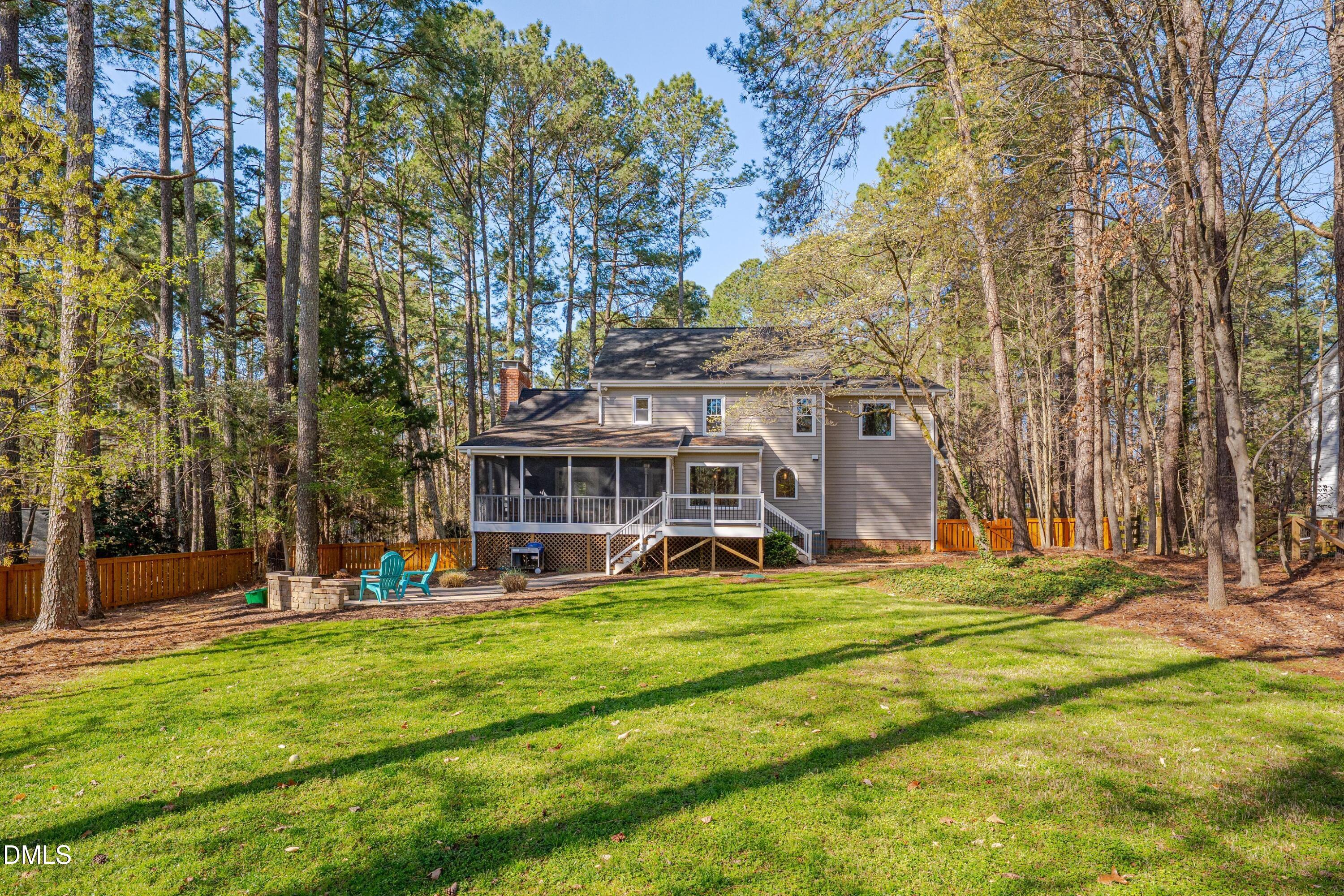 7900 Kingsland Drive Raleigh, NC 27613 - Photo 29 of 32 a view of a house with a big yard and large trees