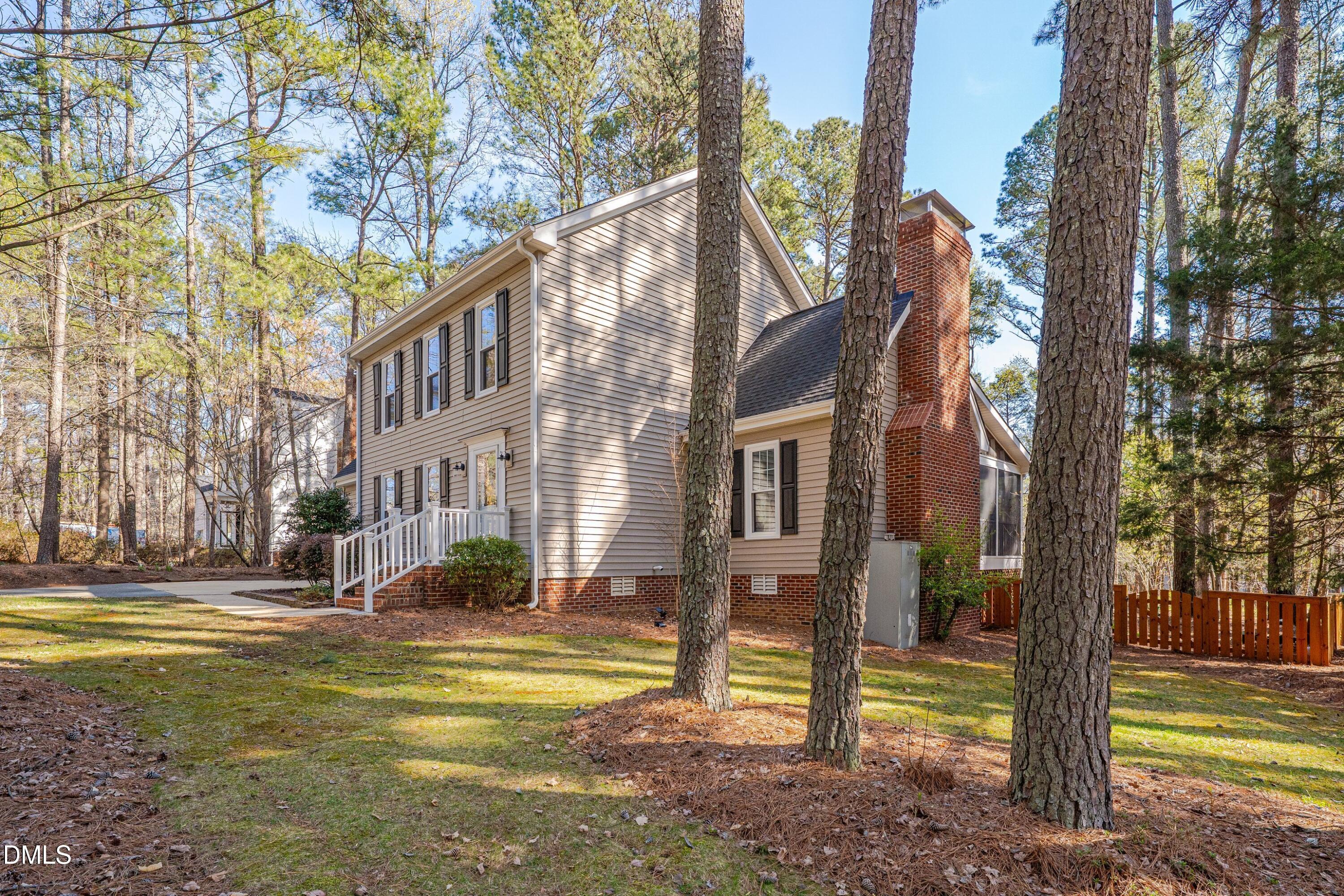 7900 Kingsland Drive Raleigh, NC 27613 - Photo 3 of 32 a view of a fountain in the middle of a yard
