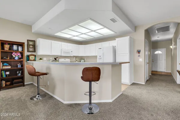 a kitchen with stainless steel appliances granite countertop a refrigerator sink and cabinets