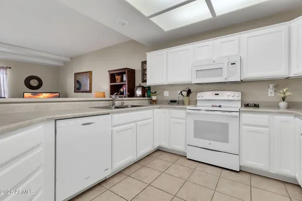 a kitchen with cabinets appliances and a counter top