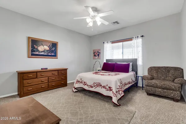 a bedroom with a bed and a couch
