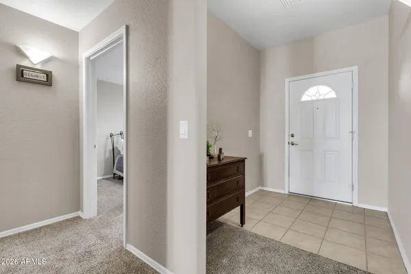 a view of bathroom with a sink and a mirror