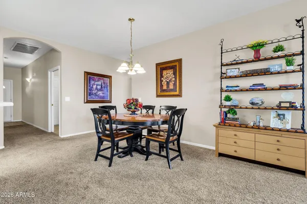 a dining room with furniture and window