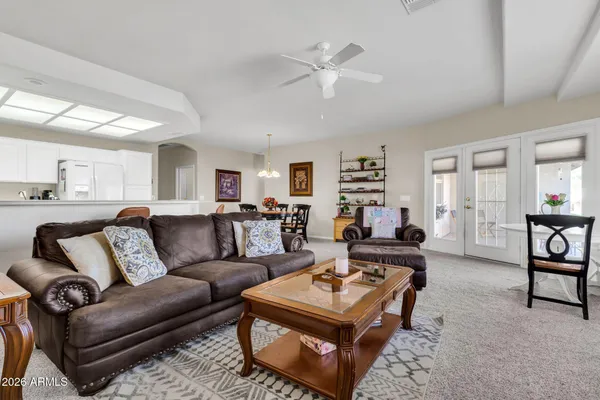 a living room with furniture and a table