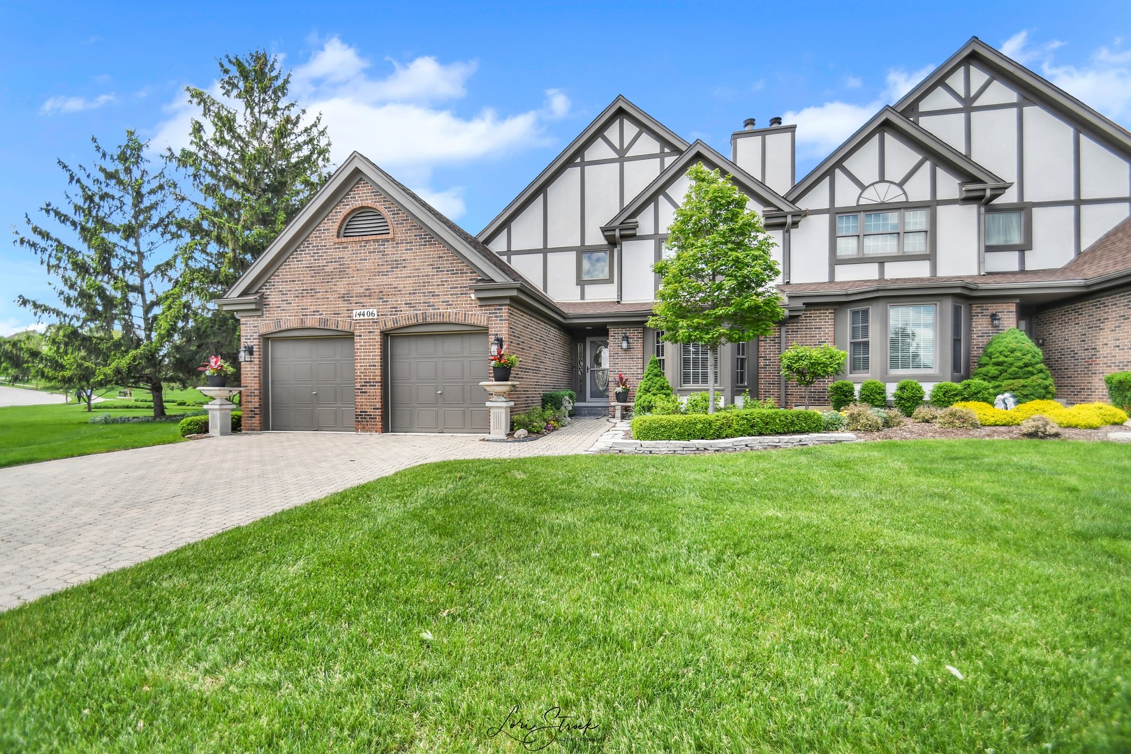 14406 Lake Ridge Road Orland Park, IL 60462 - Photo 1 of 35 a front view of a house with a yard and garage