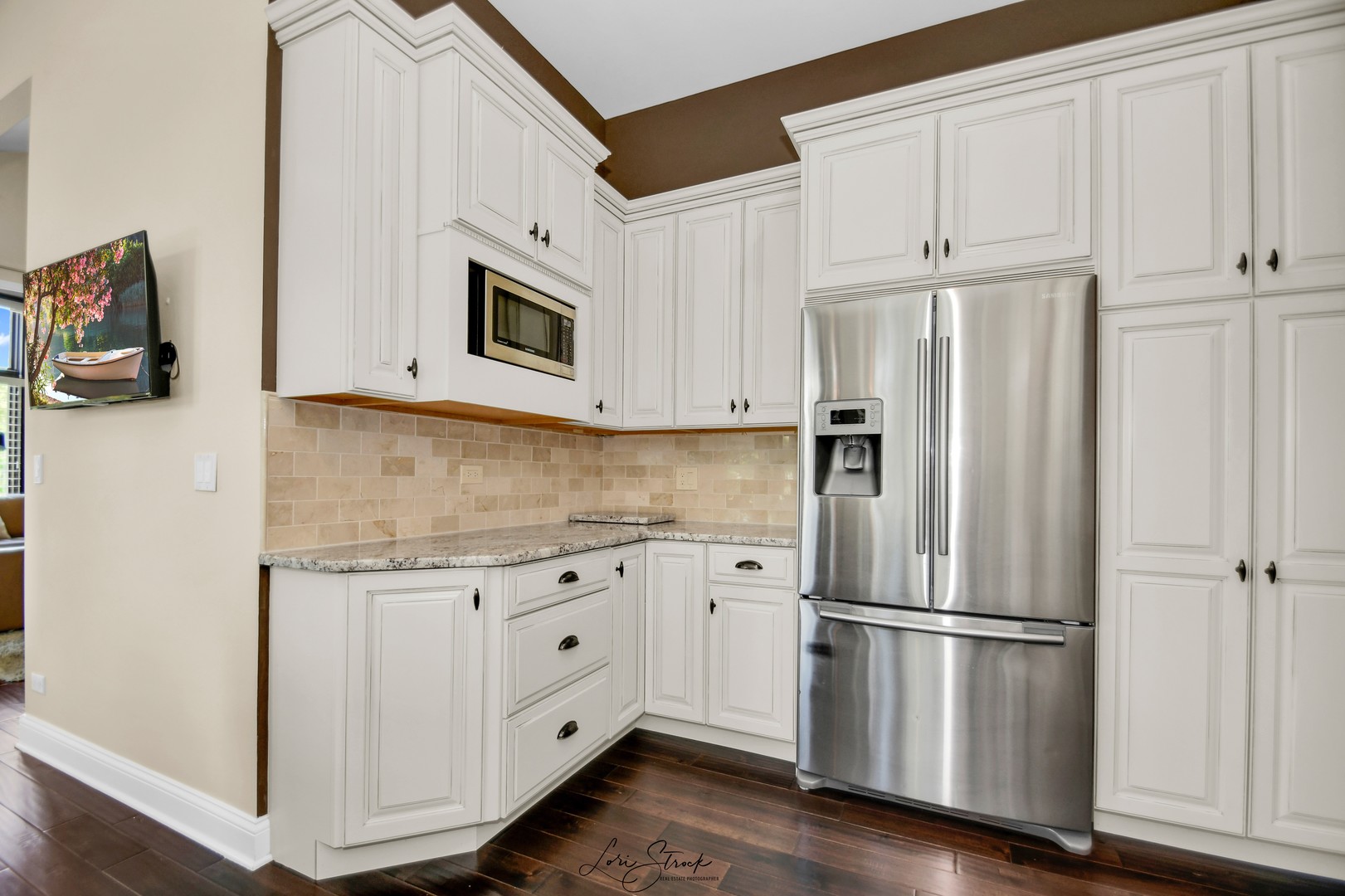 14406 Lake Ridge Road Orland Park, IL 60462 - Photo 11 of 35 a kitchen with stainless steel appliances white cabinets and a refrigerator