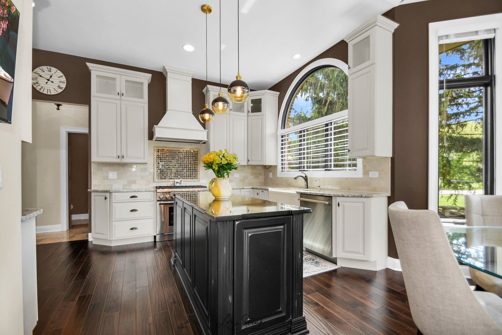 14406 Lake Ridge Road Orland Park, IL 60462 - Photo 12 of 35 a kitchen with a table chairs a stove and a window