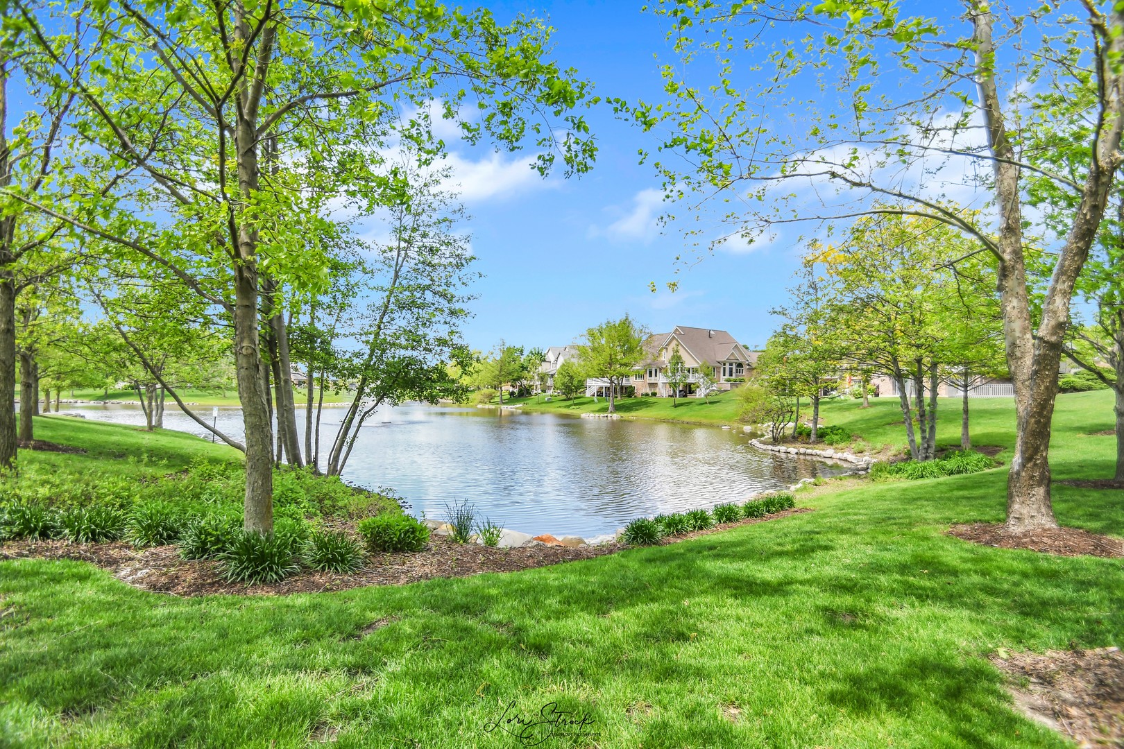 14406 Lake Ridge Road Orland Park, IL 60462 - Photo 2 of 35 a view of a lake with houses in outdoor space