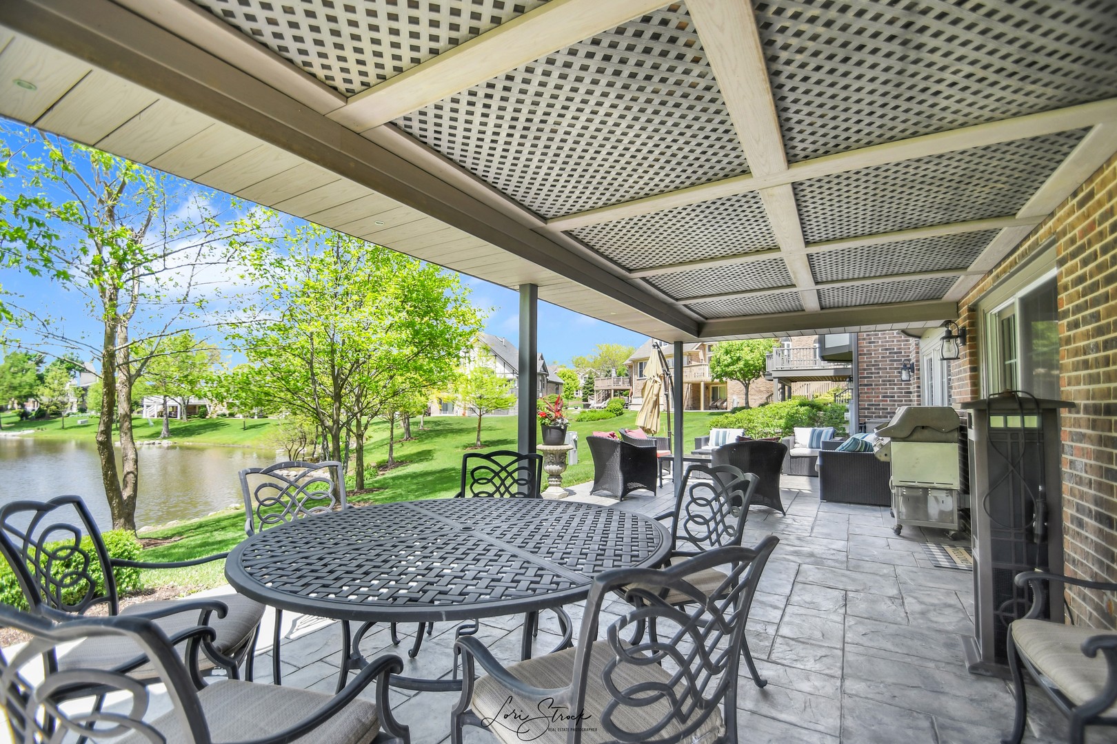 14406 Lake Ridge Road Orland Park, IL 60462 - Photo 5 of 35 a view of a patio with a table chairs and backyard