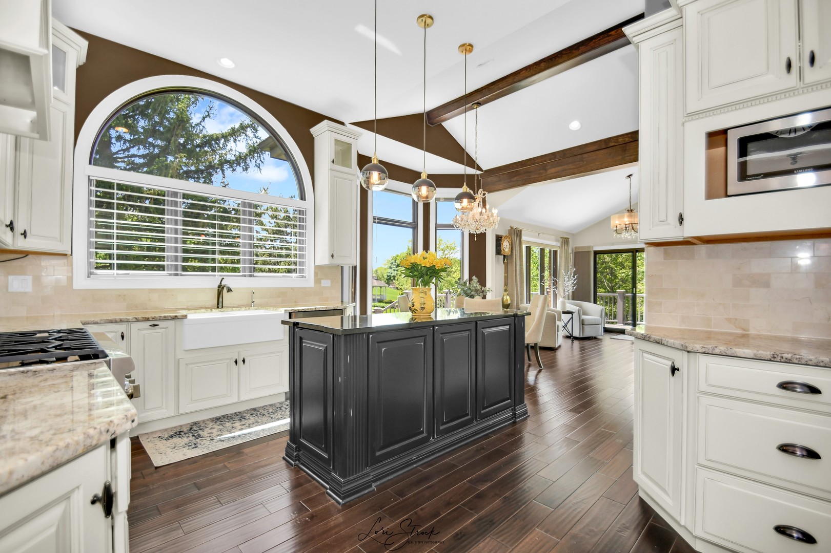 14406 Lake Ridge Road Orland Park, IL 60462 - Photo 10 of 35 a kitchen with a large window and wooden floor