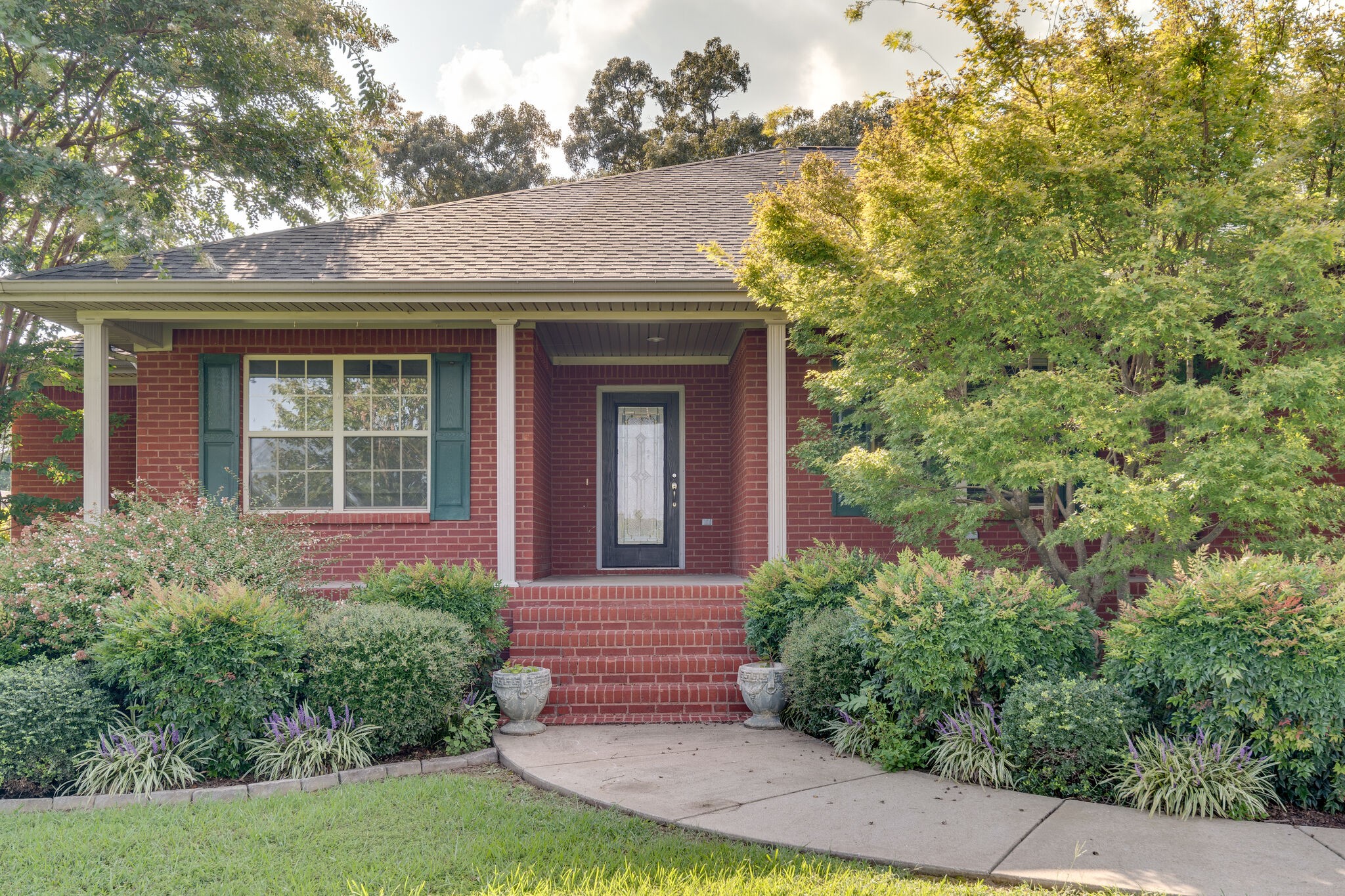 79 Jeans Road Fayetteville, TN 37334 - Photo 2 of 31 a front view of a house with garden