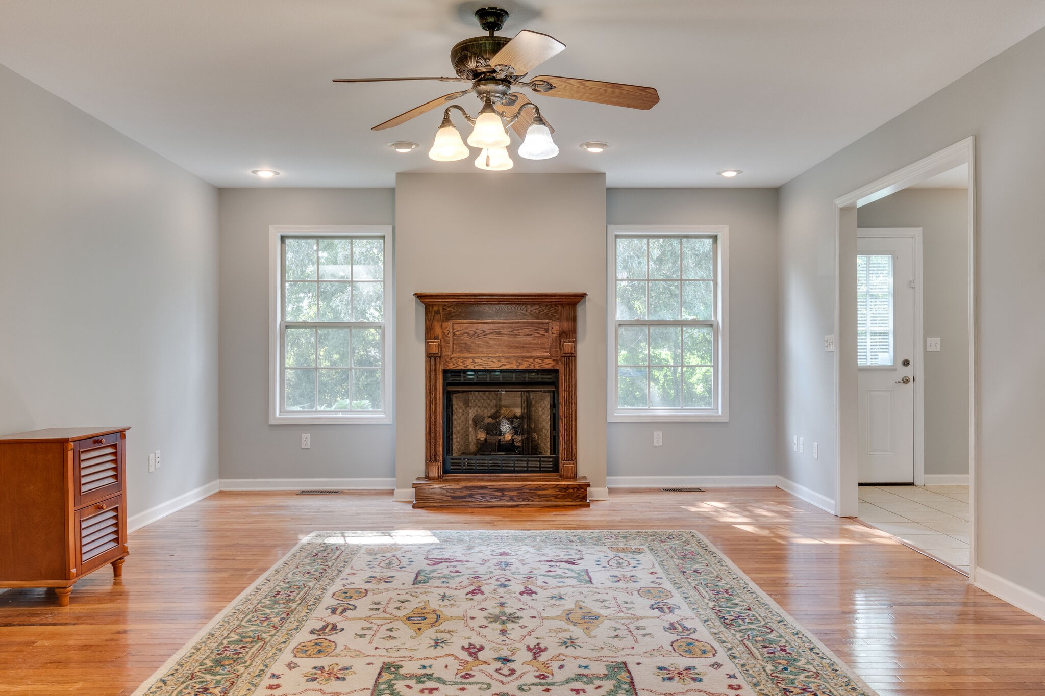 79 Jeans Road Fayetteville, TN 37334 - Photo 11 of 31 a view of livingroom with window fireplace and wooden floor