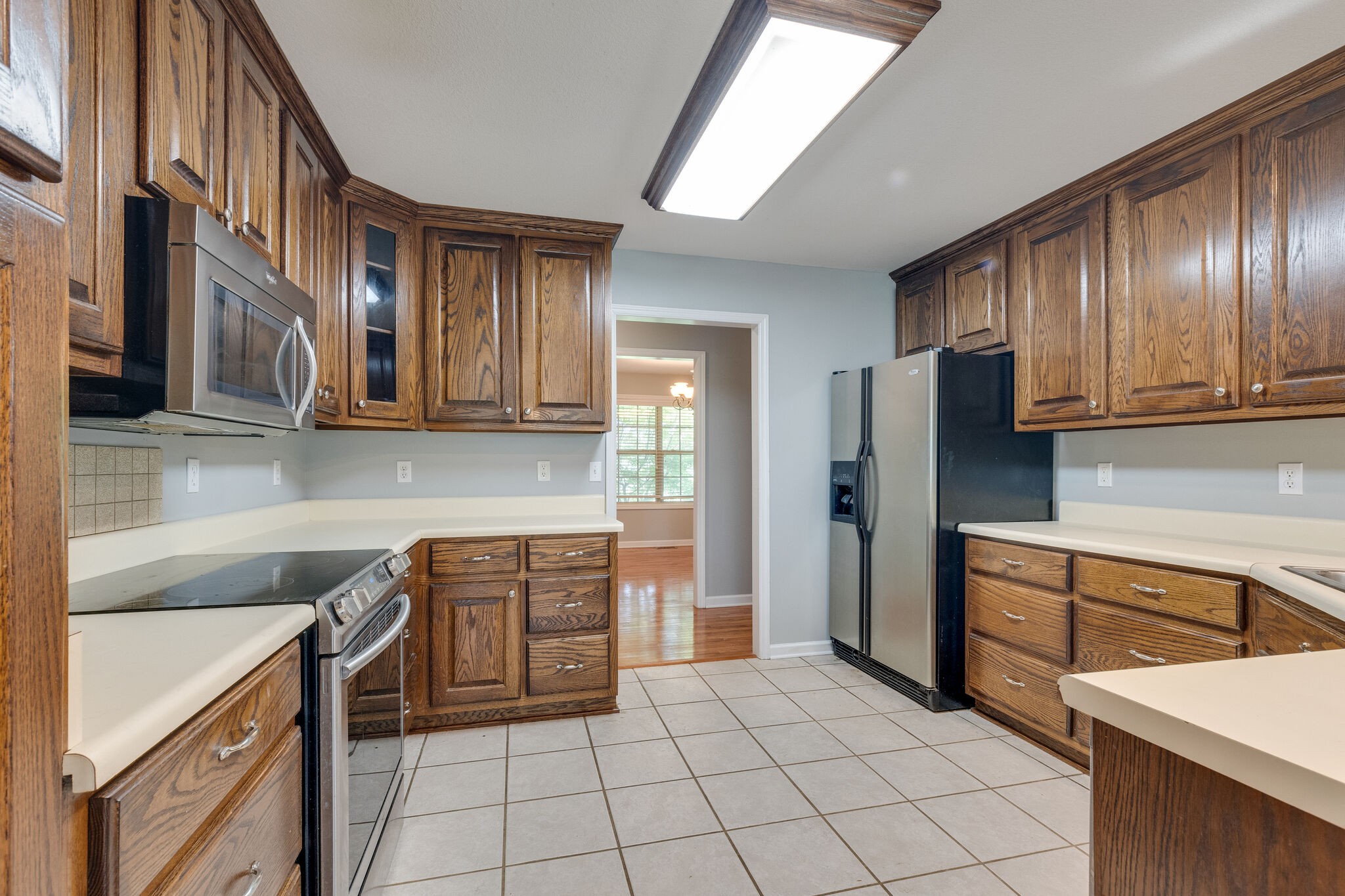 79 Jeans Road Fayetteville, TN 37334 - Photo 14 of 31 a kitchen with stainless steel appliances granite countertop a refrigerator and a stove top oven