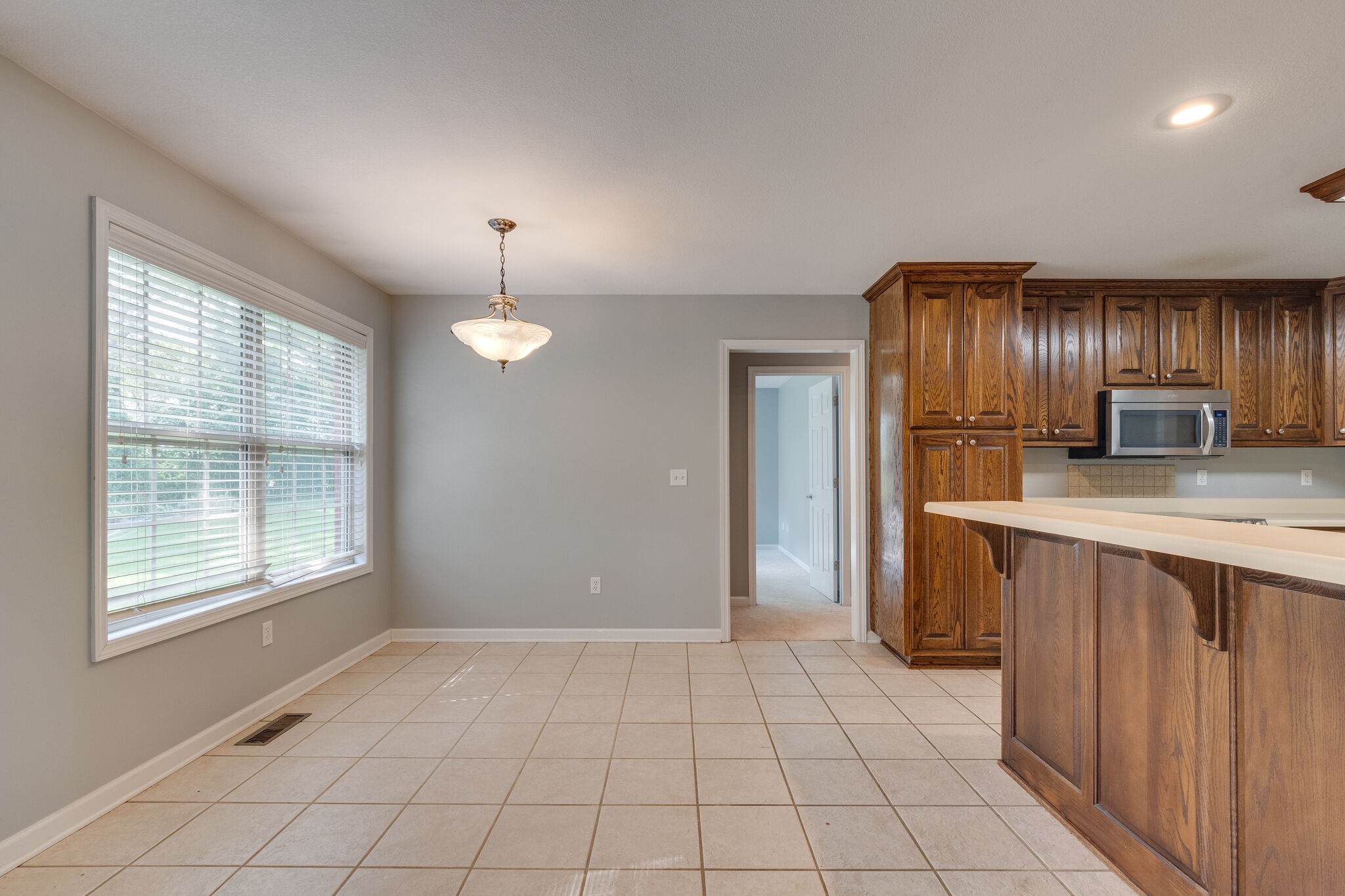 79 Jeans Road Fayetteville, TN 37334 - Photo 17 of 31 a view of kitchen with windows refrigerator and wooden floor