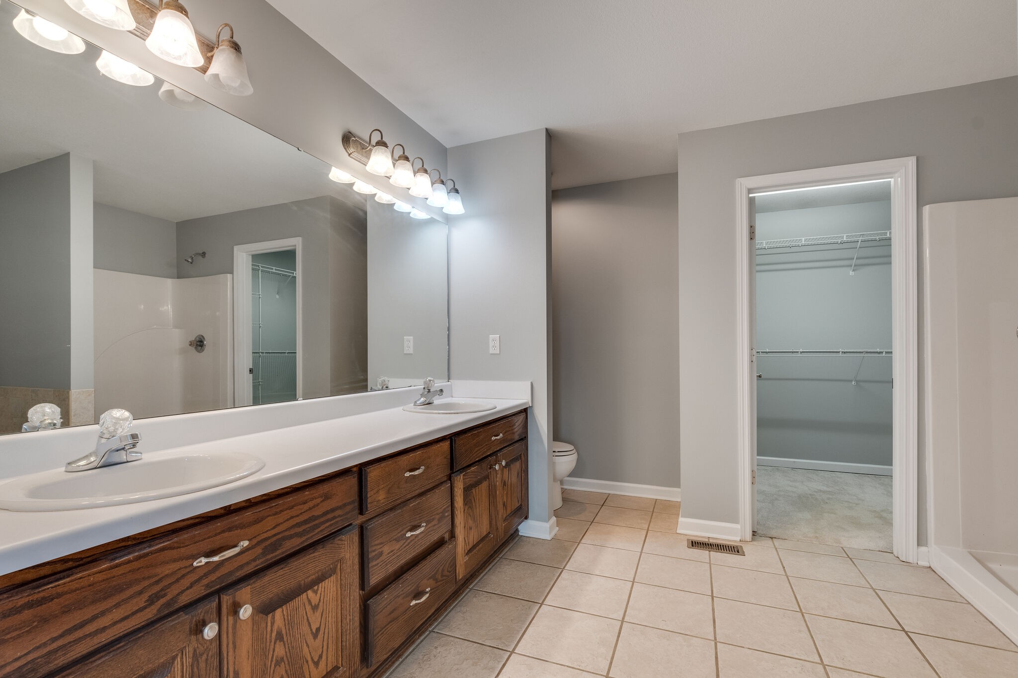79 Jeans Road Fayetteville, TN 37334 - Photo 21 of 31 a spacious bathroom with a double vanity sink and a mirror