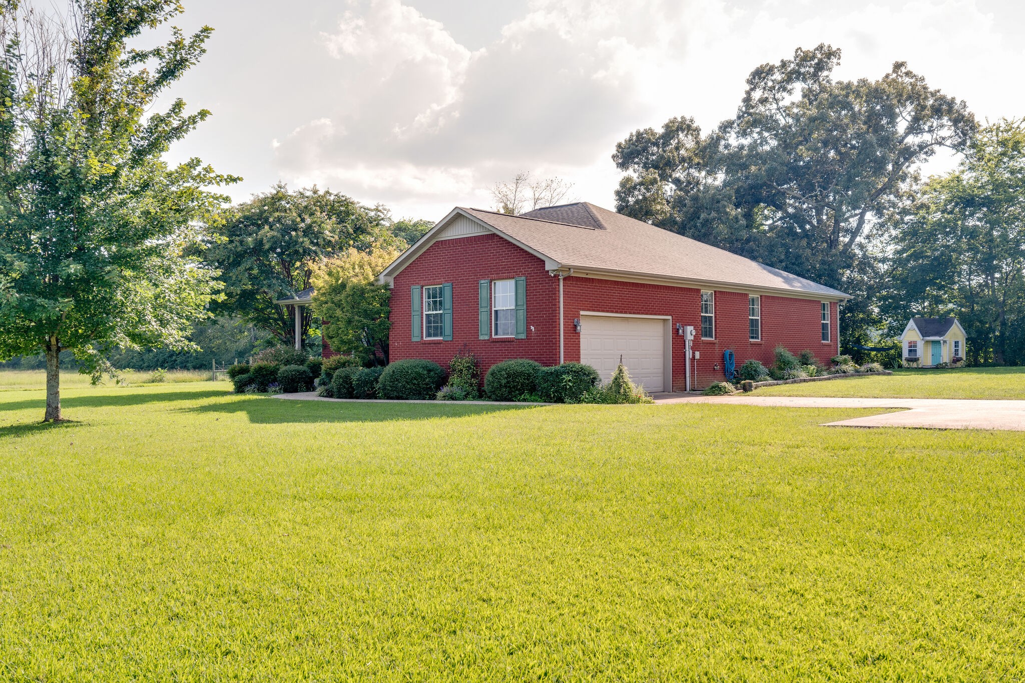 79 Jeans Road Fayetteville, TN 37334 - Photo 4 of 31 a front view of a house with a yard and swimming pool