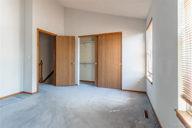 a view of empty room with windows