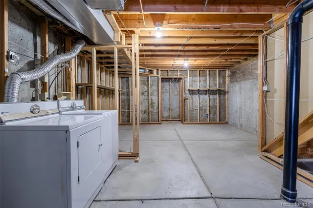 a kitchen with kitchen island granite countertop a sink and a stove top oven