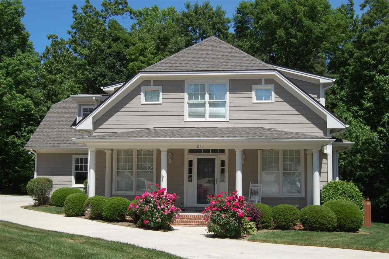 840 Nowell Ridge Road Raleigh, NC 27607 - Photo 1 of 25 Front of home w/2 Story Corban built Craftsman style w/long concrete drive, 2 car garage & 3 parking pads, full covered front porch w/brick steps, 4 white columns & 2 ½ columns on each side, 2 ceiling fans & tan color w/white trim & New Roof 2012! Exterior Front